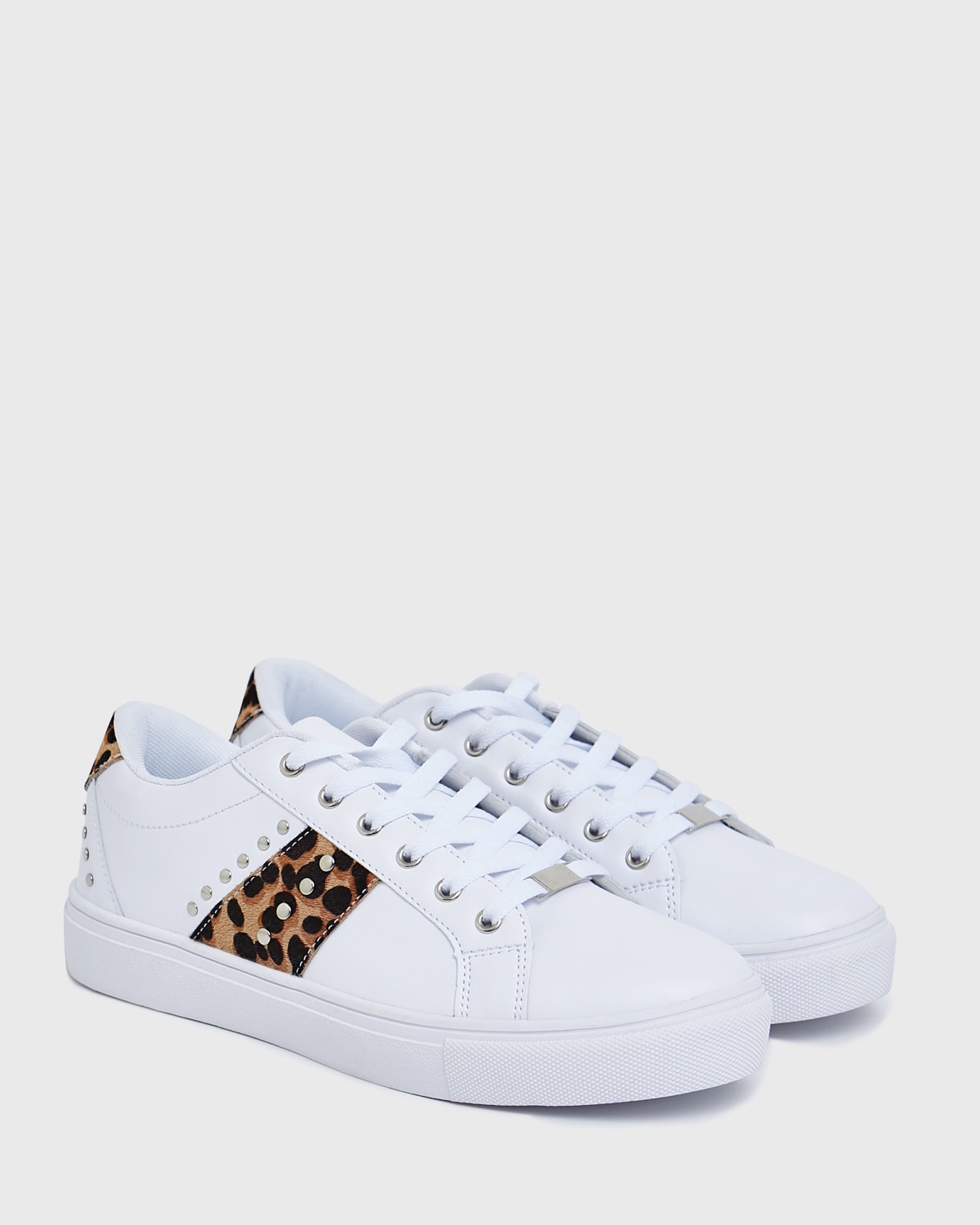white and leopard trainers