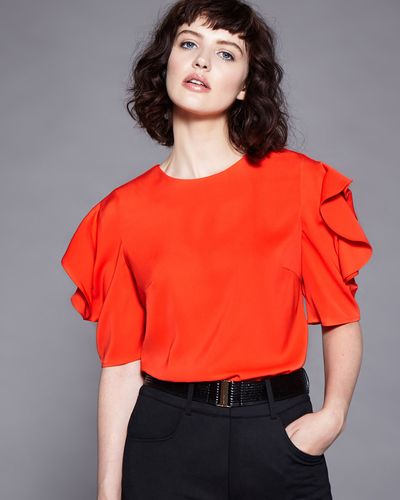 Lennon Courtney at Dunnes Stores Orange Wing Sleeve Top thumbnail